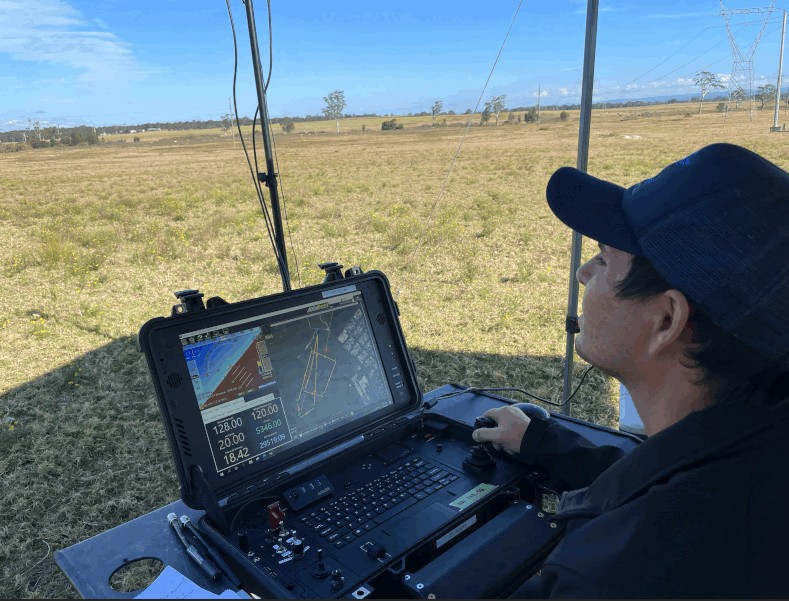Drone operator sitting with controller