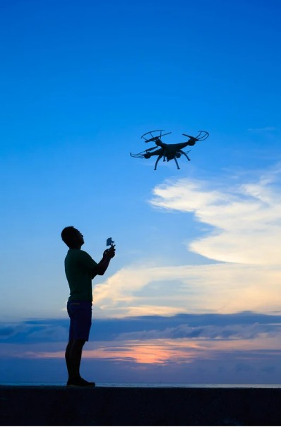 drone-shadow Man and drone in shadow